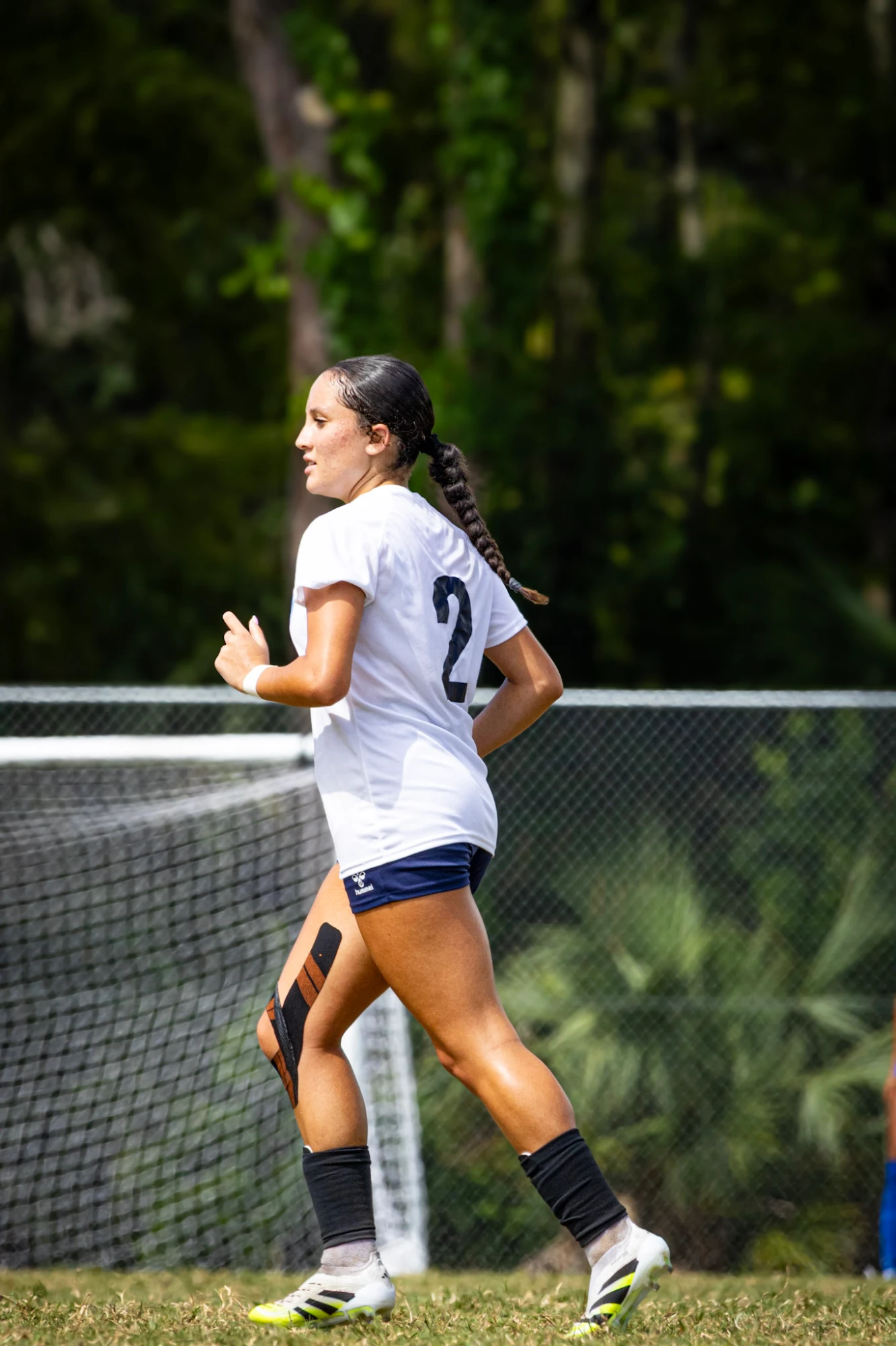 Player number 2 jogging past the goal